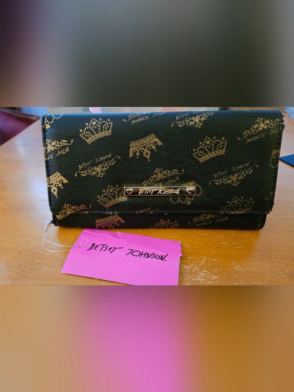 Betsey Johnson Bifold Wallet featuring an all-over metallic gold crown and tiara